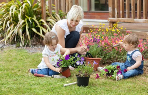 Soft landscaping work in a Penge garden with turfing and planting preparation